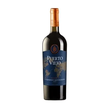 Puerto Viejo Reserve Cabernet Sauvignon 2019, vino tinto del Valle Central. Botella con etiqueta azul oscuro, mapa mundi dorado y emblema de barco.