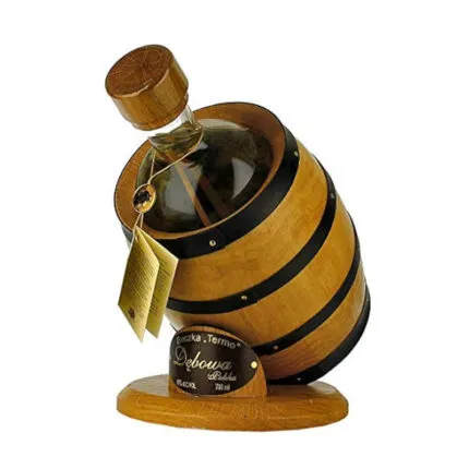 Barril Vodka Debowa Polska 1L en barrica de madera clara con bandas negras y botella de vidrio con tapón de corcho de madera.