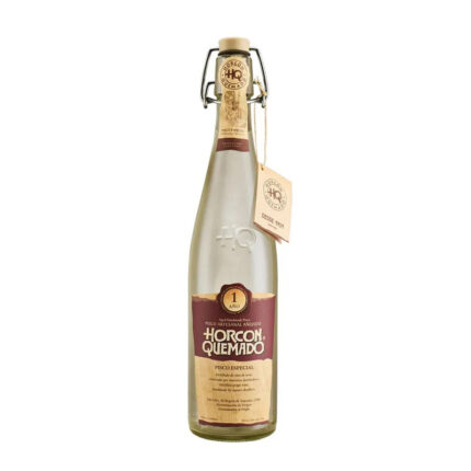 Botella de Pisco Horcon Quemado Especial 1 año 35° 645cc, pisco chileno añejado en roble, con etiqueta marrón y tapón abatible.