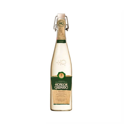 Botella de Pisco Horcon Quemado Gran Pisco 3 años 46° 645cc, de color ámbar claro, con cierre de balancín y etiqueta verde artesanal.