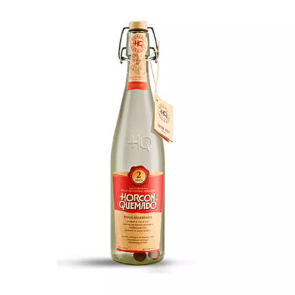 Botella de Pisco Horcon Quemado Reservado 2 años 40°, con tapa de fianza y etiqueta roja.